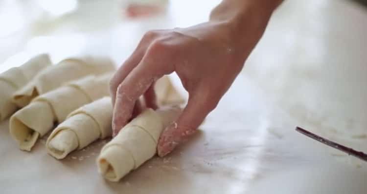 Roll dough to make croissants