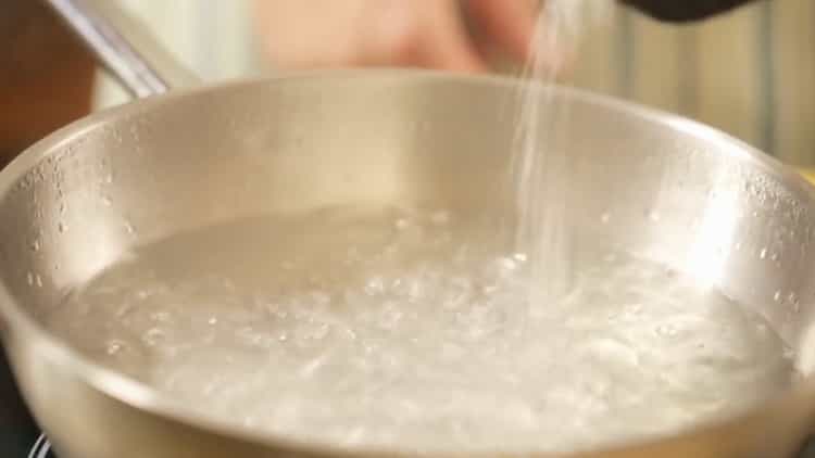 To cook salmon pasta, put the pan on the fire