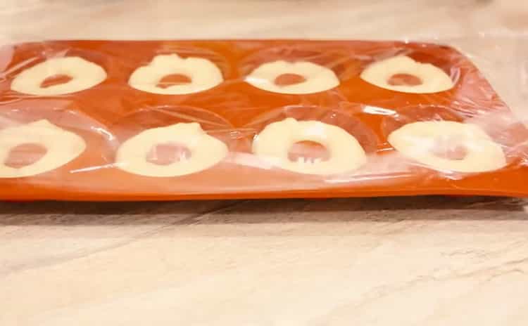 To make donuts in the oven, cover the pan