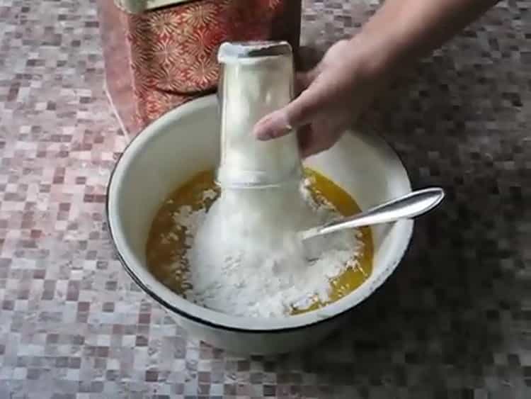 Sift flour to make a fresh pastry for pies