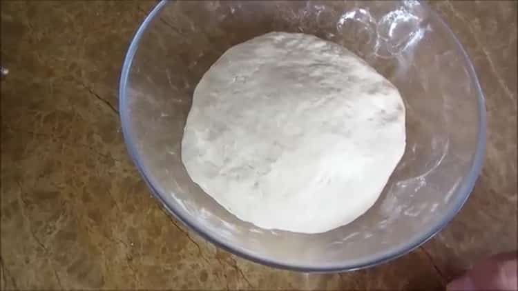According to the recipe, to make white bread in the oven, knead the dough