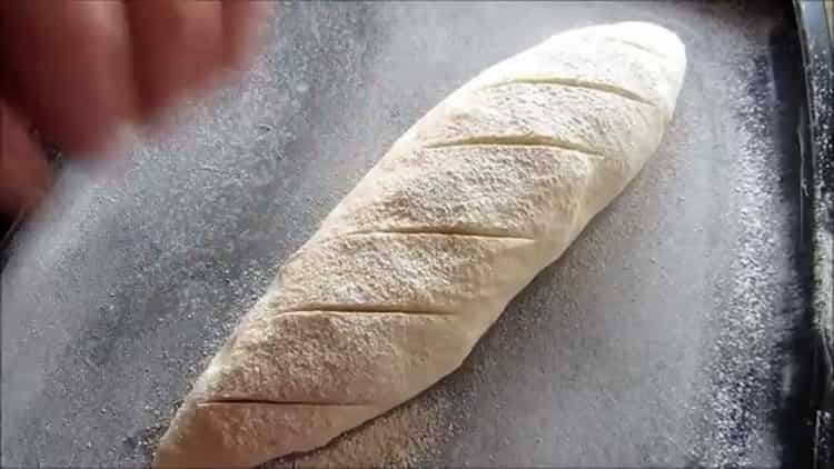According to the recipe, to make white bread in the oven, cut the dough