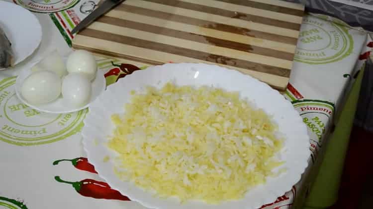 To prepare herring under a fur coat, chop onions