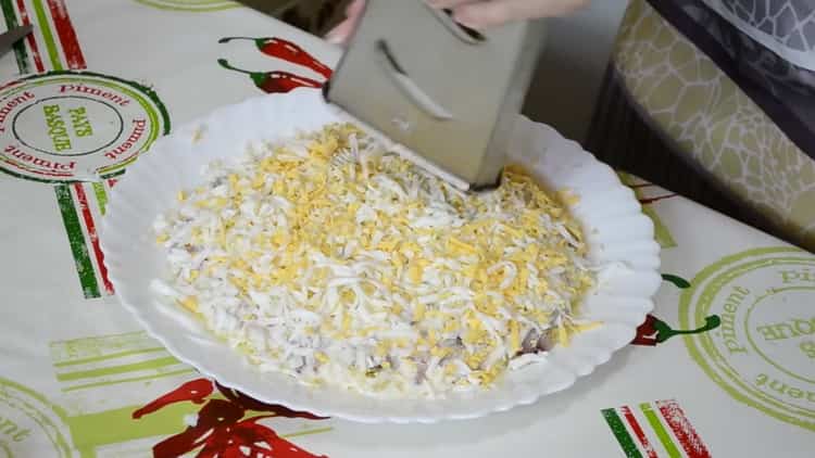 To prepare herring under a fur coat, rub the eggs