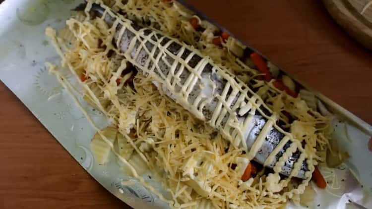 For cooking mackerel with vegetables in the oven, grease the fish with mayonnaise