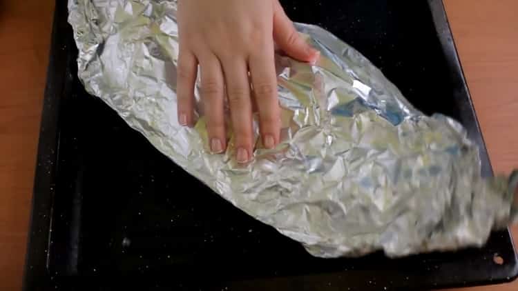 To cook mackerel with vegetables in the oven, preheat the oven