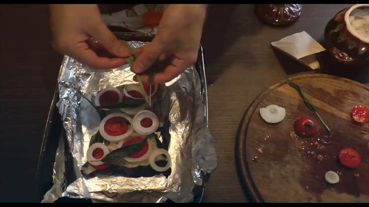 To cook catfish steak in the oven, preheat the oven