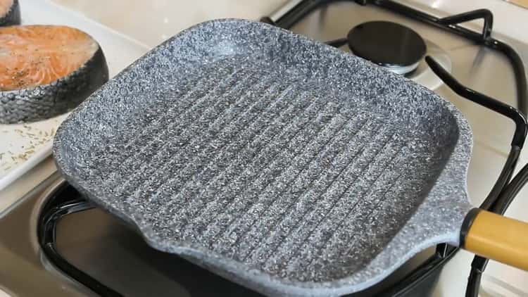 To cook salmon steak, heat the pan