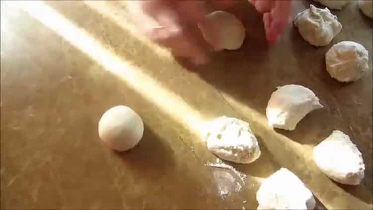 To make Turkish flatbread, divide the dough into portions.