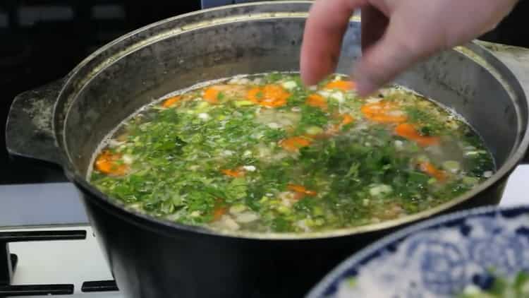 To make salmon soup, add greens to the broth