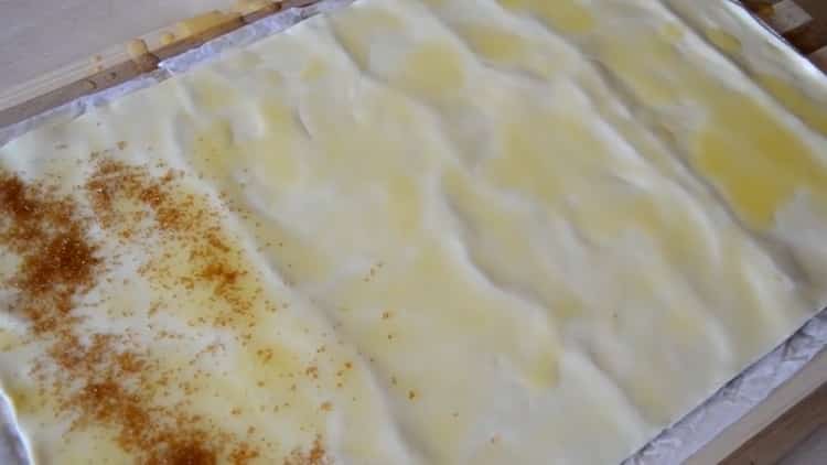 To make puff pastry ears, put sugar on the dough