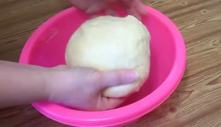 Knead the dough to make French buns