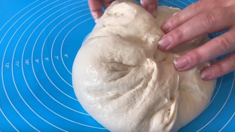 Knead the dough on a work surface.