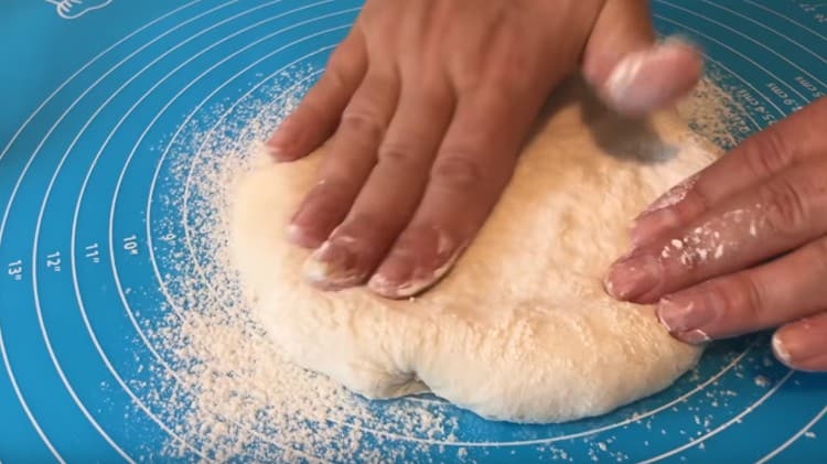 Knead each ball of dough into a flat cake.