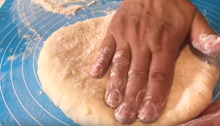 Knead the stuffed bag with your hand.