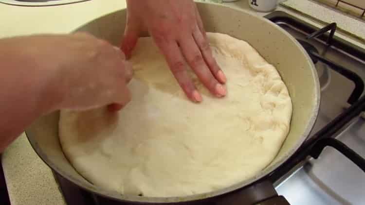 To make khachapuri in a pan, prepare a skillet