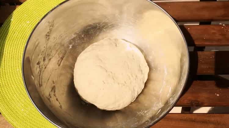 Knead the dough to make khachapuri
