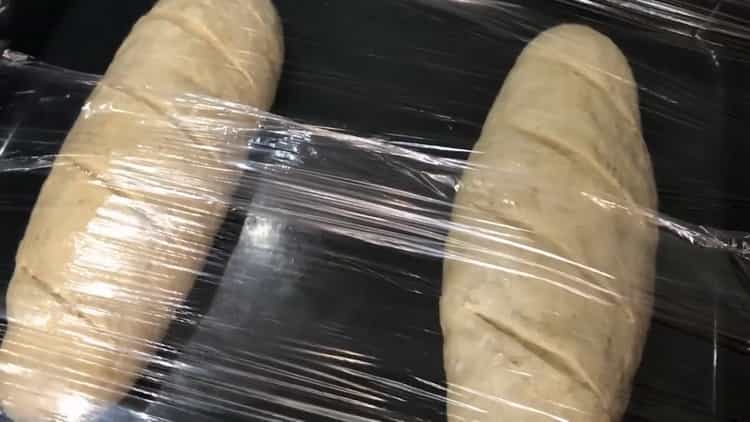To make bread on whey, place the dough under a film