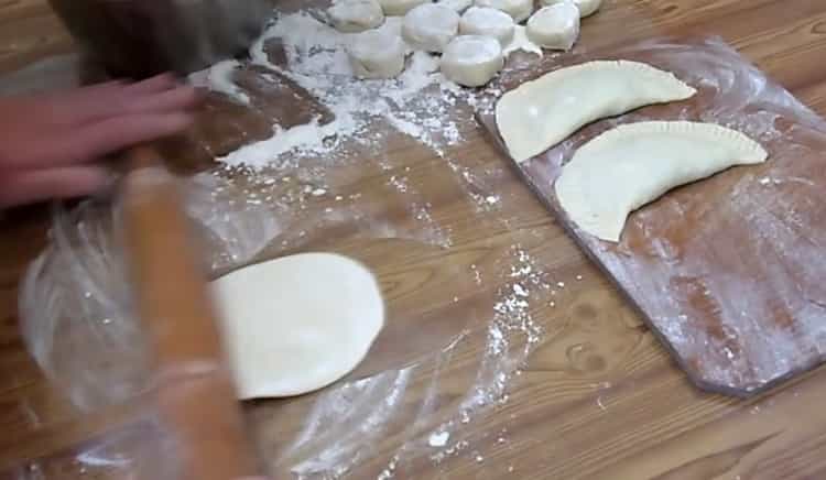 To make chebureks with cheese, roll out the dough