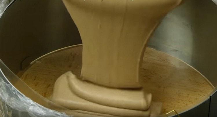 Pour half the mousse to the bottom of the split mold.