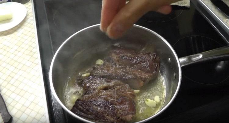 Salt and pepper the meat.