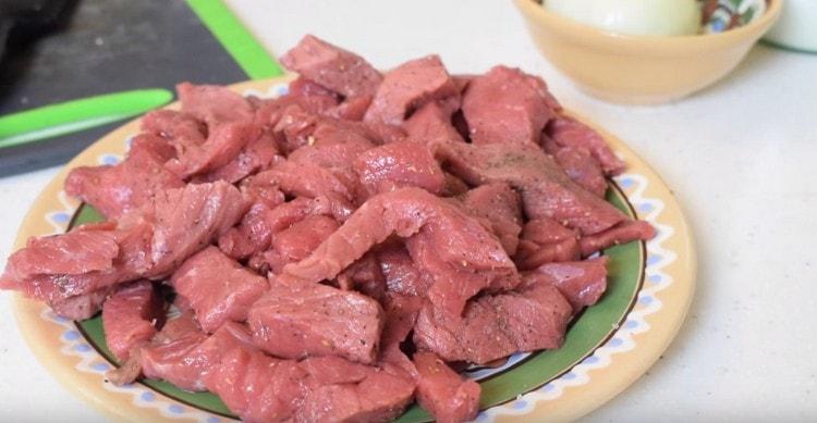 Salt and pepper the meat.