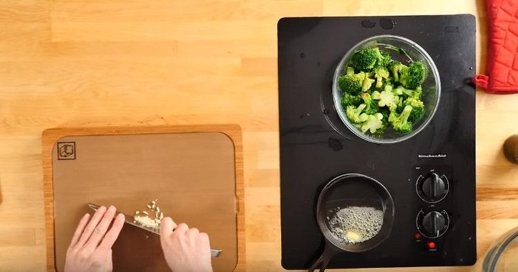 Heat a piece of butter in a pan, add chopped garlic to it.