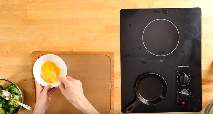 Beat the eggs in a bowl.