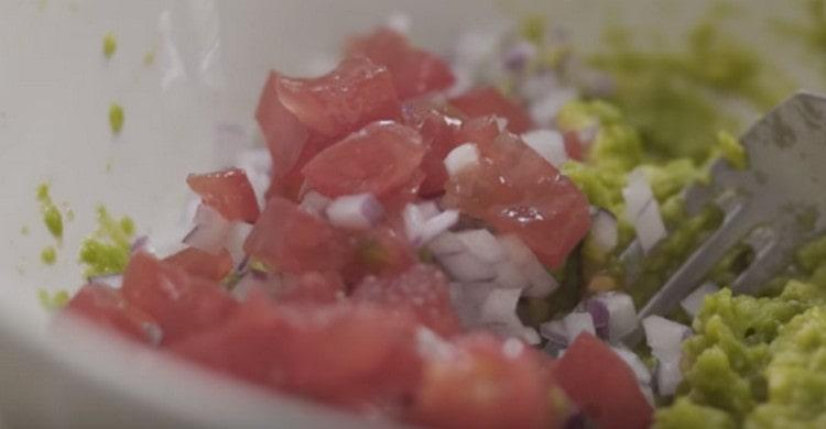 Add onion and tomato, chopped into small pieces.