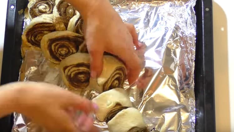 We make cuts on the roll, but we don’t cut it to the end, and we turn the dough in different directions.