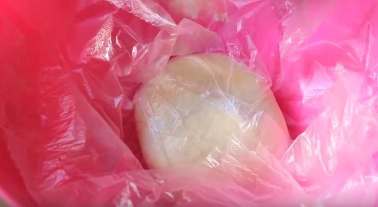We cover the dough with a bag and put in the refrigerator.