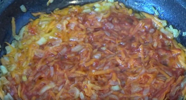 Then add tomato paste to the vegetables.