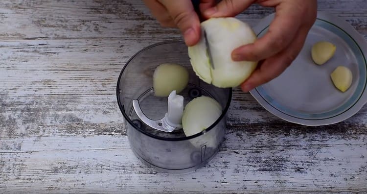 Grind onions and garlic in a blender.