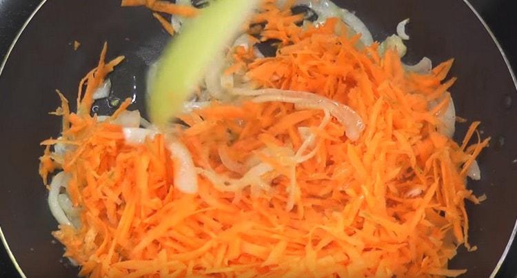 Add carrots to the onion.