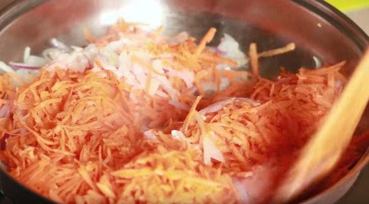 Add carrots to the onion.