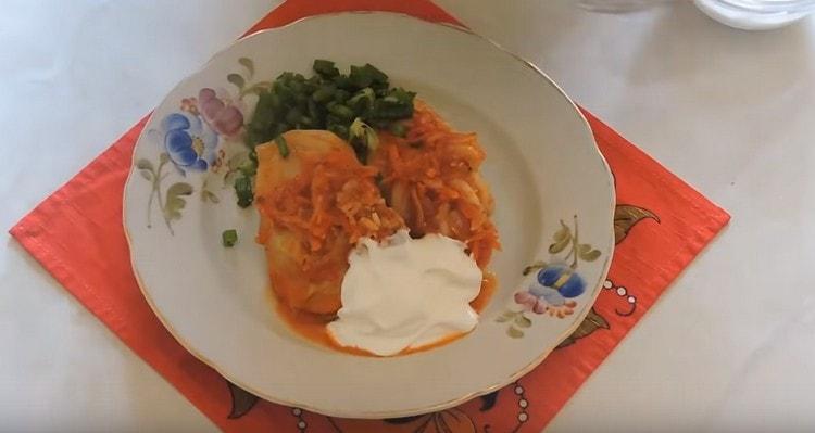 Serve stuffed cabbage with sour cream. greens.