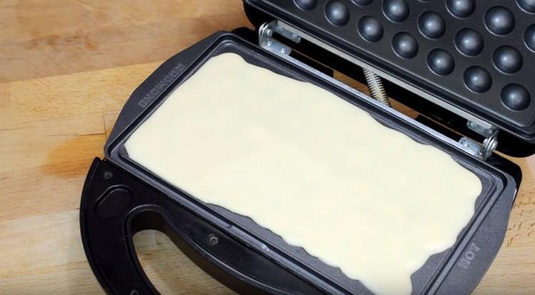 It is convenient to bake such waffles in a multi-bakery or an electric waffle iron.