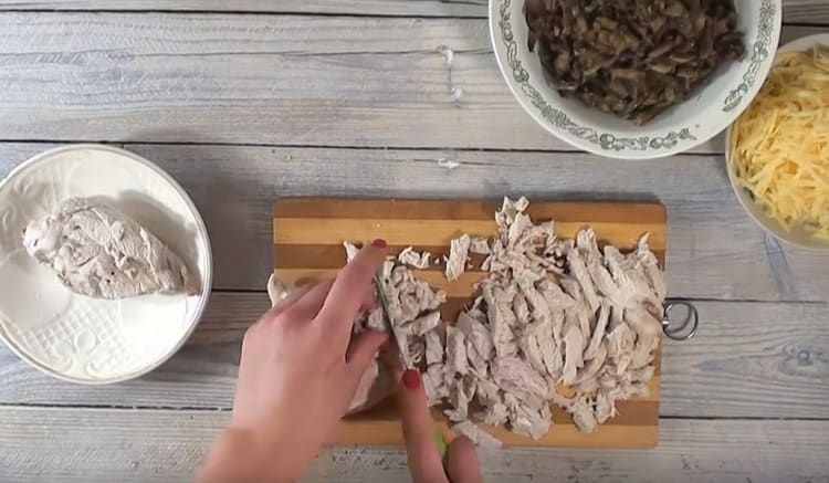 Chop finely boiled chicken.