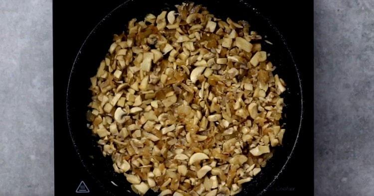 Fry mushrooms with onions to evaporate the liquid.