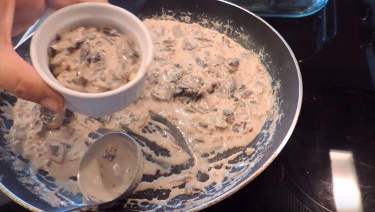 We shift the mushroom julienne into the cocotte.