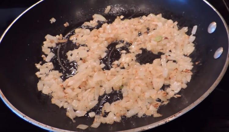 Fry the onion until golden brown.
