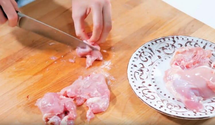 Cut the chicken into pieces.