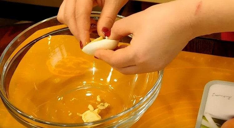 cut each egg in half and gently take out the yolks.