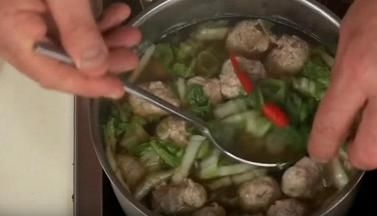 Add hot pepper to the soup.