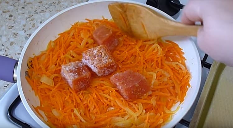 Add frozen tomatoes to the vegetables.