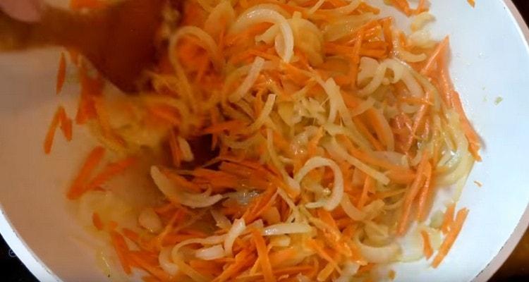 Add carrots to the onion.