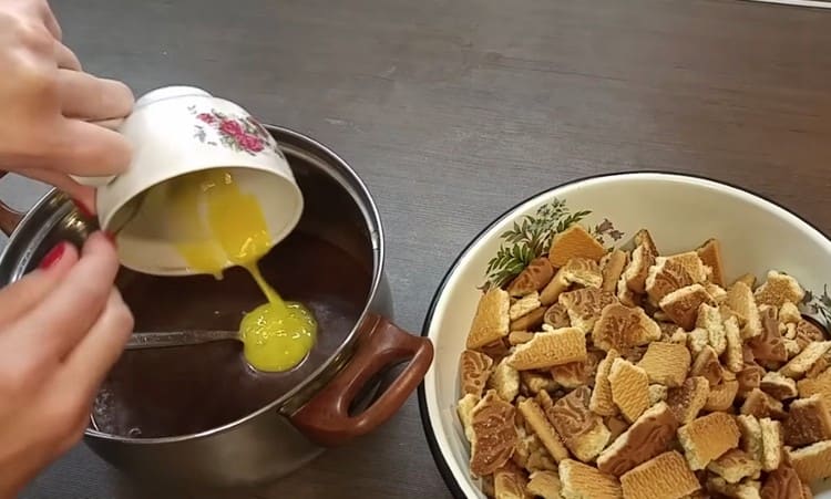 Add one yolk to the mass.