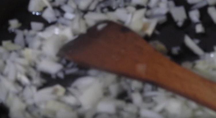 Fry chopped onions in a pan.