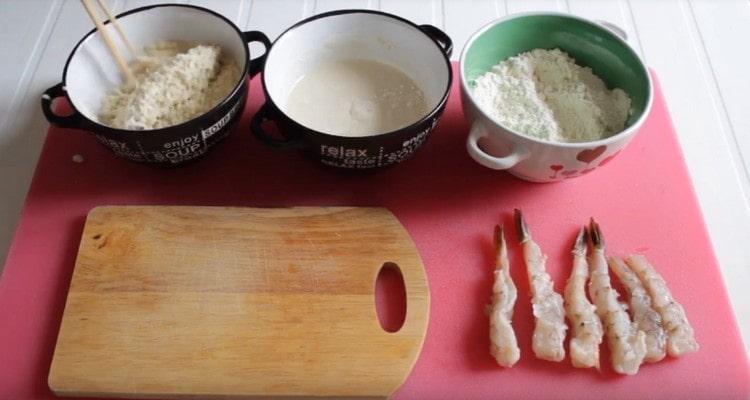 After the batter, roll the shrimp in breadcrumbs.