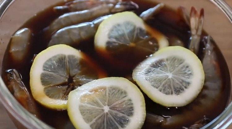 Add half the lemon, sliced in circles.